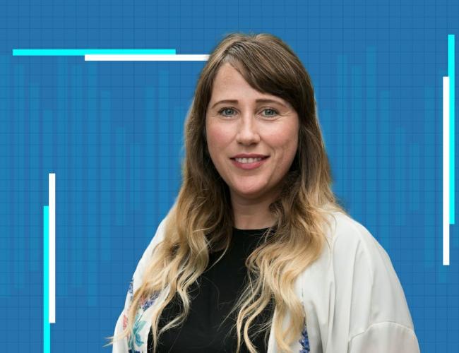 siobhan braybrook in a white sweater against a blue grid background