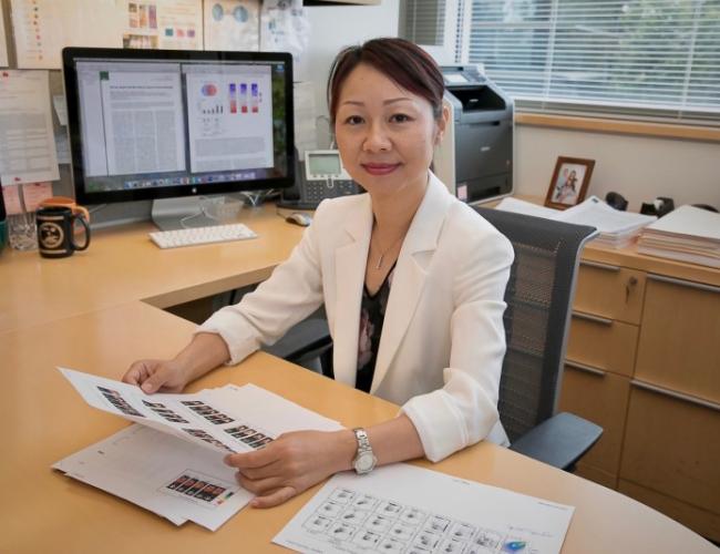 Headshot of Lili Yang at her desk