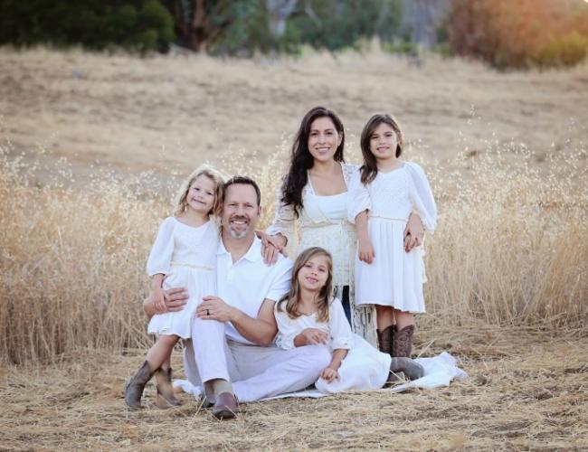 Family photo: Christian and Alysia Padilla-Vaccaro with daughters Gigi (left), Annabella (seated) and Evangelina. Evangelina was born with a rare genetic immunodeficiency disorder, but thanks to a novel gene therapy at UCLA, her immune system was restored.