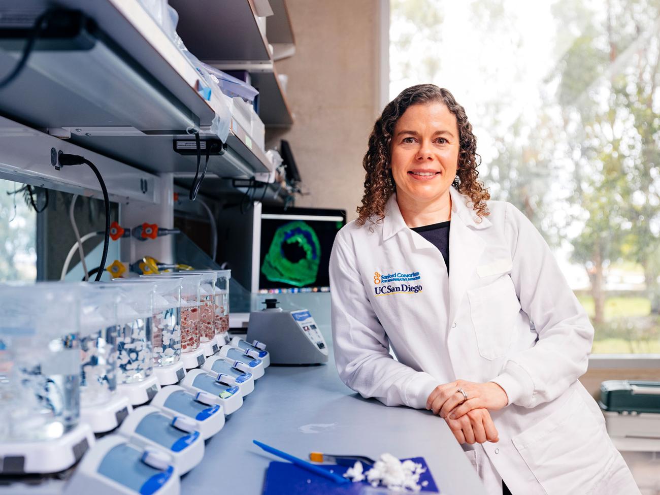 UC San Diego bioengineering professor Karen Christman smiles in a lab.