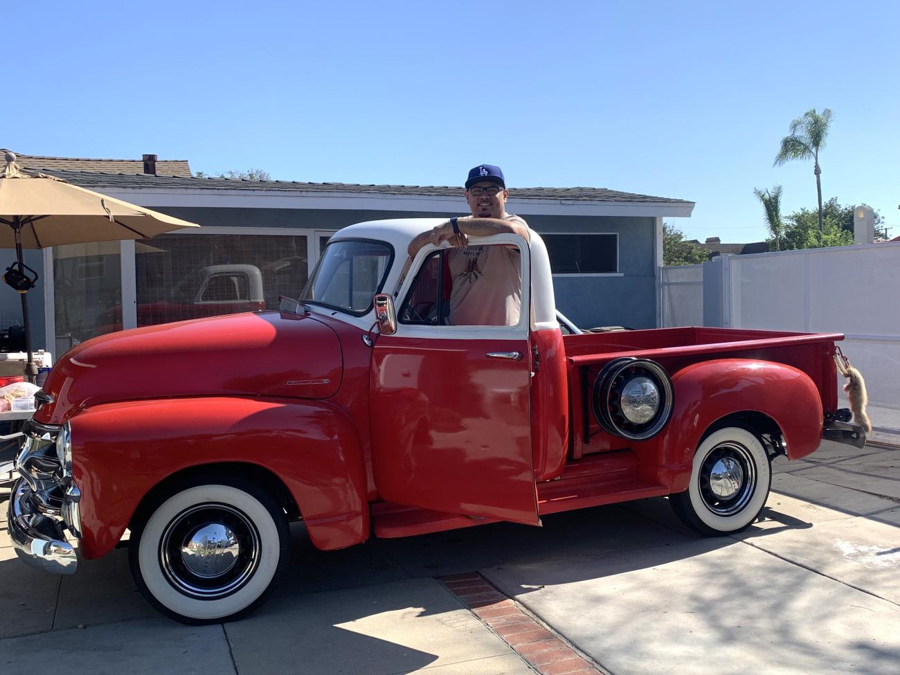 UCLA faculty Anthony Covarrubias in his red 1954 Chevy truck