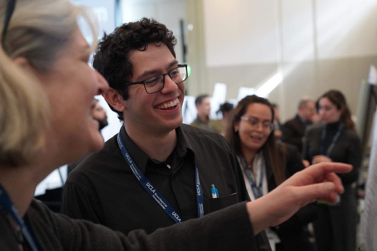 Bridges trainee Cristian Rodriguez poster presentation during a Symposium with Samantha Butler
