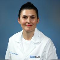 UCLA physician-scientist Clemence Bonnet smiles for a headshot. 