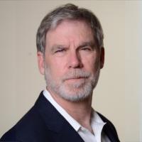 Stanley Nelson smiles for a photograph.