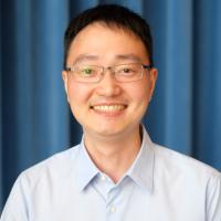 Jijun Huang smiles for a headshot.