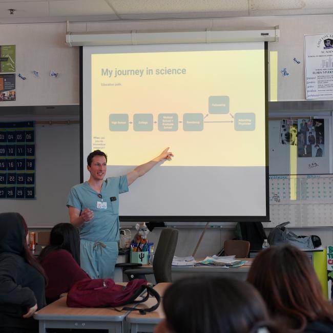 Tyler McCaw presents his science journey to high school students during a BSCRC outreach visit