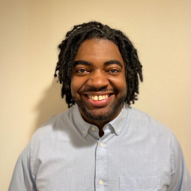 Researcher D'Juan Farmer smiles for a headshot