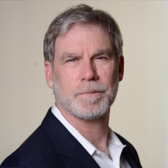 Stanley Nelson smiles for a photograph.