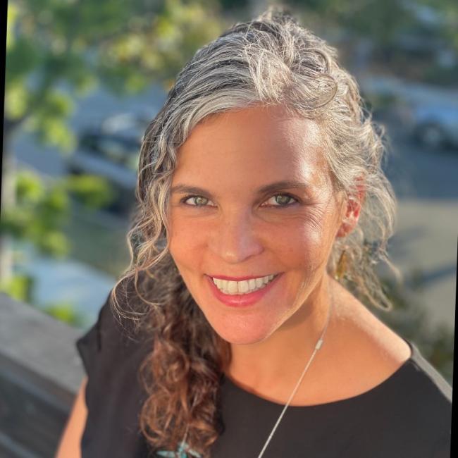 Angenieux, Brigitte smiles for a headshot