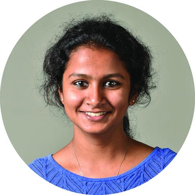 Damodaren, Nivedita smiles for a headshot.