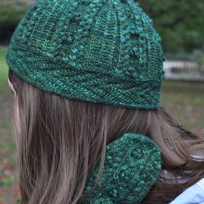 green fitted knit hat on a woman's head