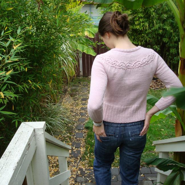 woman wearing a pink knitted sweater