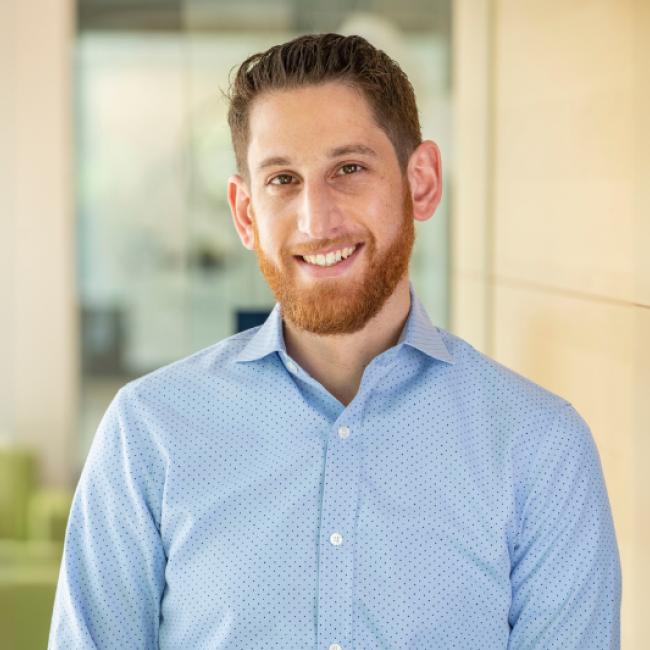 Jonathan Herman smiles for a photograph.