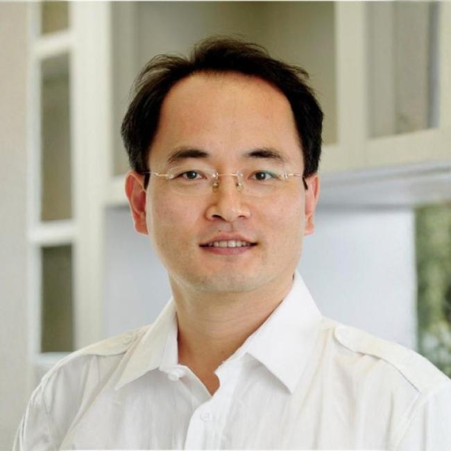 UCLA scientist Kitai Kim smiles for a headshot.