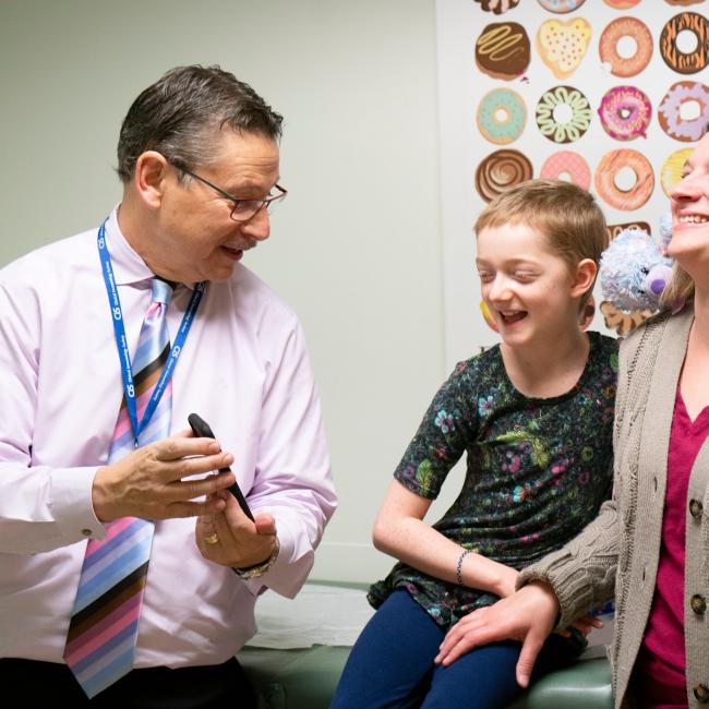 Donald Kohn with clinical trial patient and mom