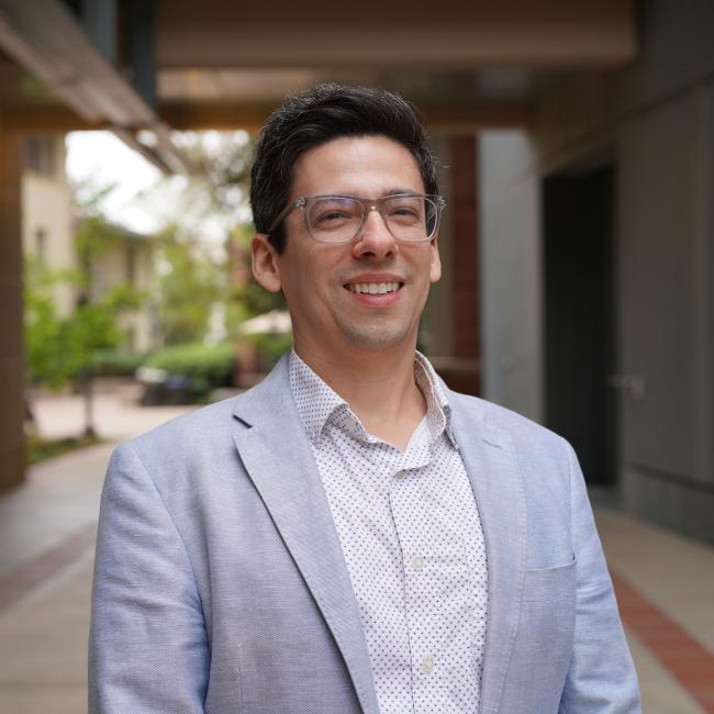A headshot of researcher Michael Wells on the UCLA campus.
