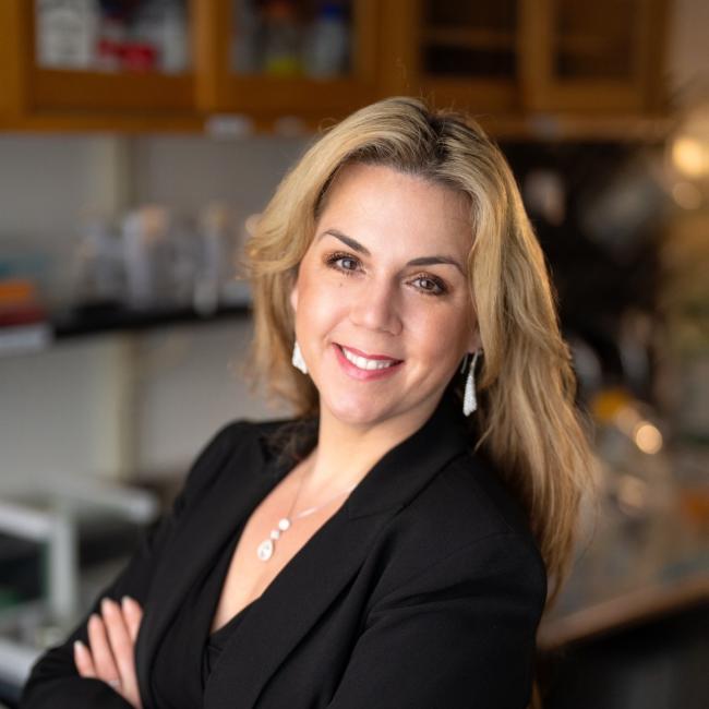 Dr. Tanya Stoyanova, a researcher at UCLA, smiles in a lab.