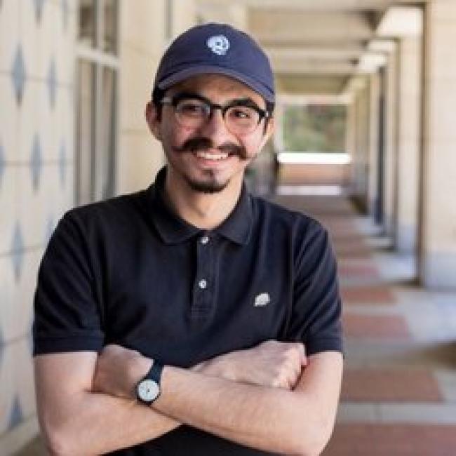 Torres, Alejandro smiles for a photograph