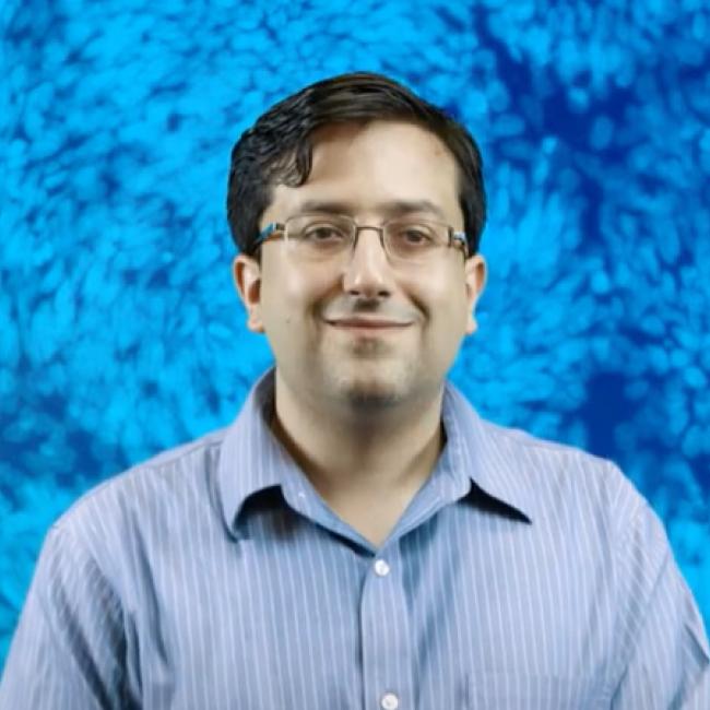 William Pastor smiles in a photograph.