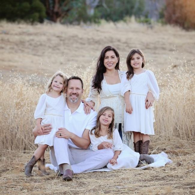 Family photo: Christian and Alysia Padilla-Vaccaro with daughters Gigi (left), Annabella (seated) and Evangelina. Evangelina was born with a rare genetic immunodeficiency disorder, but thanks to a novel gene therapy at UCLA, her immune system was restored.